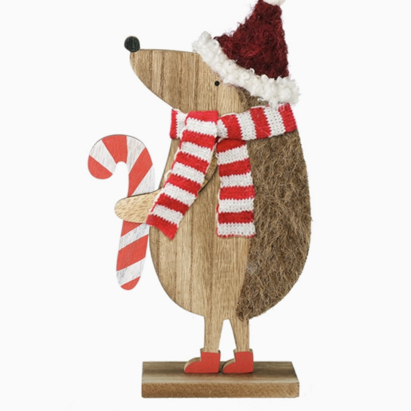 Christmas hedgehog ornament wearing a red hat and holding a candy cane